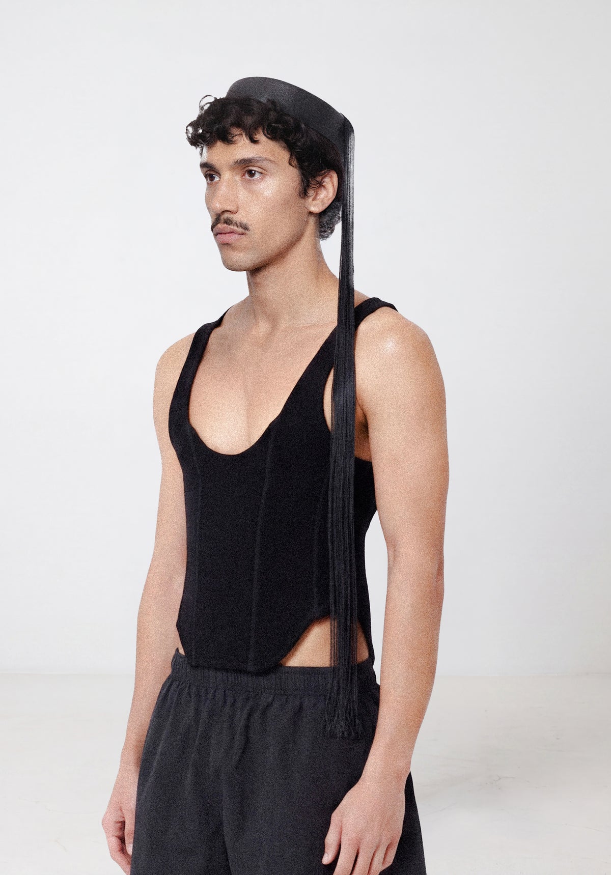 Corset Tank worn — structured black corset with a deep scooped neckline